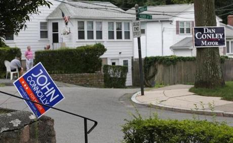 In West Roxbury, signs for Conley and Connolly compete. 
