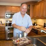 Red Sox broadcaster Don Orsillo preparing his chicken and sausage dish. 