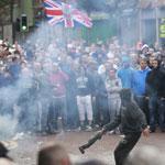 Loyalist protesters clashed with riot police in Belfast center on Friday. A number of people, including officers, have been injured during violence linked to an Ireland Republican Army anti-internment parade.