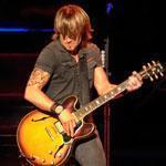 Keith Urban, backed by a four-man band, performed at Comcast Center Saturday night.