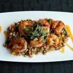 Spicy grilled mojito shrimp skewers are served at Fenmore American Bistro. 