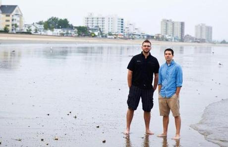 Myke Wilkerson and Brandon Allison, pictured on Revere Beach, moved their families here from Texas to start a new church.
