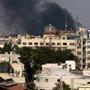 Smoke rises amid shelling in Damascus on Sunday. Syria said it made a deal for UN experts to test for toxic nerve agents.