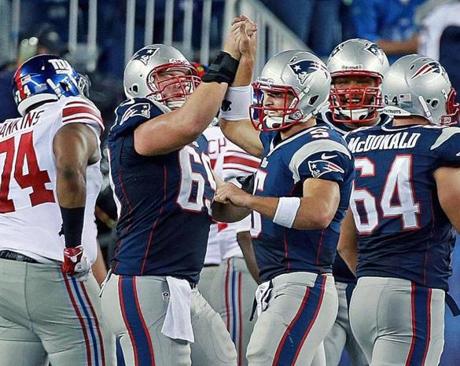 Tim Tebow and center Matt Stankiewitch took it to another level after the Patriots scored their final touchdown.
