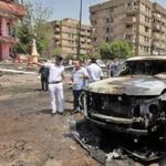 Security officials inspected the scene of a bomb blast targeting Egyptian interior minister Mohammed Ibrahim near his home in Cairo, Egypt.