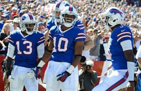 Bills receiver Robert Woods (10), celebrated with teammates after a first-half touchdown.
