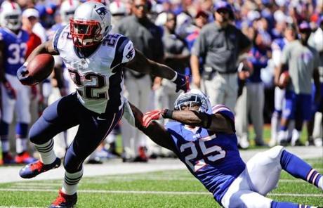 Stevan Ridley broke a tackle by Da’Norris Searcy.
