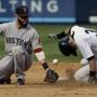 The Yankees’ Ichiro Suzuki stole second base while Dustin Pedroia tried to get a hand on the ball during the ninth inning.