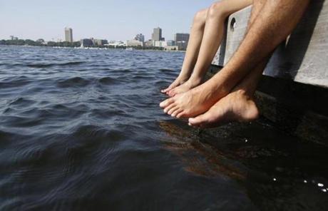 Emerson sophomores Hunter Harris, 19, and Dean Vilchik, 20, dipped their feet in the Charles River.
