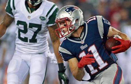 Wide receiver Julian Edelman moved up the field as the Jets' Dee Milliner moved in.
