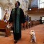 Celestine Reid, associate minister at Belmont A.M.E. Zion Church in Worcester, is assisted by a service dog due to her hearing impairment.