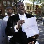 Bishop Gerald Seabrooks showed a statement made by Cathleen Alexis, mother of Washington Navy Yard gunman Aaron Alexis, in Brooklyn on Wednesday.
