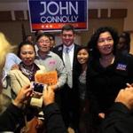 John Connolly posed for a photo with supporters after speaking during a rallyin West Roxbury on Tuesday. 
