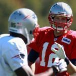 Tom Brady yelled out to Kenbrell Thompkins, left, and Josh Boyce during Wednesday’s practice. 
