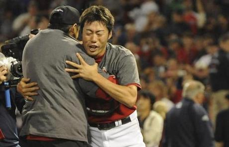 The win marks the 20th save for Uehara (right).
