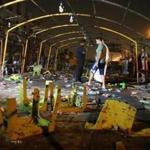 People inspected the site of a suicide bombing at a funeral in a Shiite part of Baghdad.