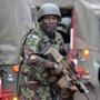 A Kenyan soldier arrived at an upmarket Nairobi mall early Sunday. Government forces remained locked in a fierce firefight with Somali militants inside the mall. 