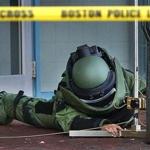 A Boston bomb squad officer sprawled out as he examined the device.