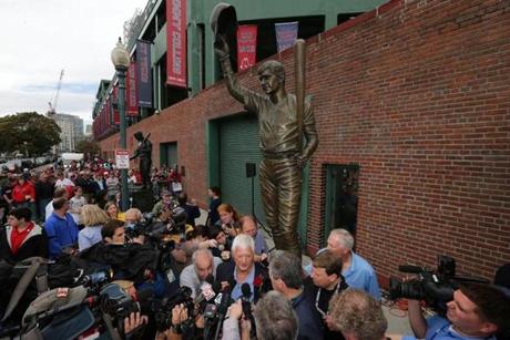 Reporters surrounded Carl Yastrzemski at the unveiling of his statue Sunday.
