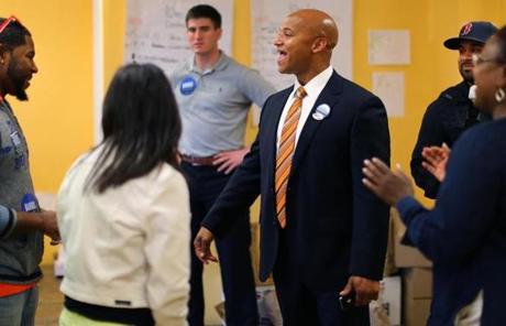John Barros took time out to talk his campaign workers at his Mattapan campaign office.
