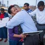 Isaura Mendes was comforted by friend James Hills 
Thursday after the death of her nephew Leroy Carvalho the day before. In years past, she lost two of her sons to street violence.