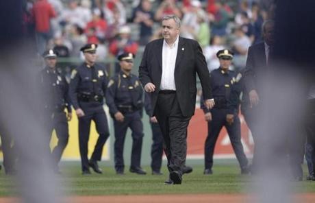 Boston Police Commissioner Edward Davis walked onto the field before the game.
