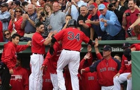 David Ortiz was congratulated in the dugout after scoring in the fourth inning. 

