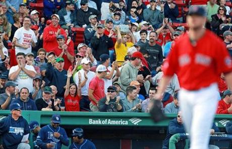 The crowd cheered after Lester sent down the Rays in order in the first inning.
