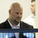 Jared Remy, son of Boston Red Sox broadcaster Jerry Remy, stood during his arraignment.