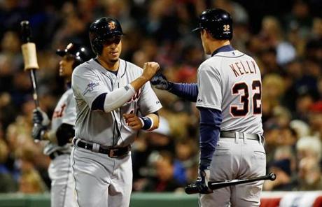 Victor Martinez (left) celebrated with Don Kelly after scoring in the second inning.
