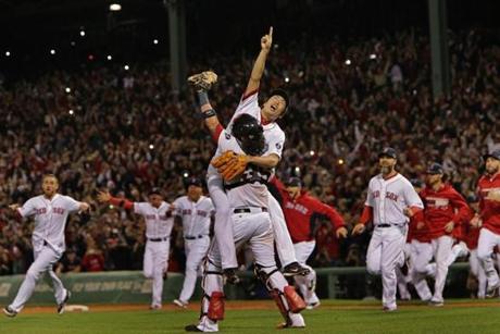With the last out of the ALCS in the books, closer (and series MVP) Koji Uehara celebrates with catcher Jarrod Saltalamacchia as the rest of the Red Sox rush to get in on the fun.
