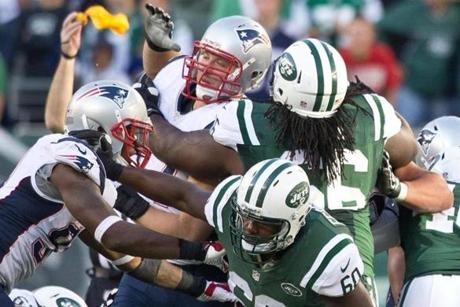 The Patriots’ Chris Jones (center) was flagged for a penalty that is new to this season and hadn’t yet been called in a game.
