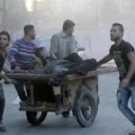 Men transported injured victims in Aleppo, Syria, during clashes between rebels and progovernment forces Saturday. 