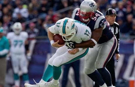 Dont’a Hightower tackled Ryan Tannehill in the third quarter.
