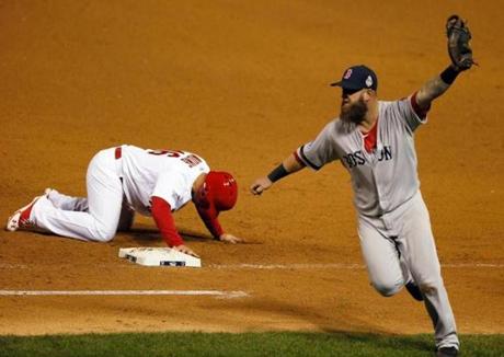 Mike Napoli celebrated after tagging out Kolten Wong on a pickoff throw for the final out.
