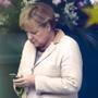 German Chancellor Angela Merkel using her cell phone at the chancellery in Berlin in 2011. 