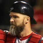 David Ross takes the low route and slams into Cardinals counterpart Yadier Molina, but he was tagged out at the plate trying to score from second base in the Red Sox’ two-run seventh.