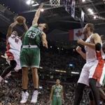 Toronto Raptors guard DeMar DeRozan drives to the basket against Boston Celtics forward Kris Humphries.