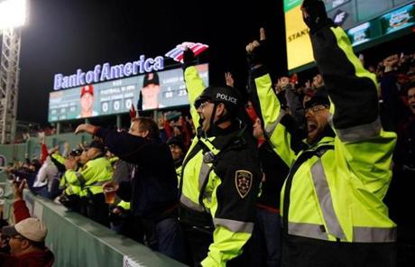 Boston University police officers cheered as the Red Sox scored in the fourth inning.
