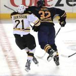 Buffalo’s John Scott levels the Bruins’ Loui Eriksson in an Oct. 23 game.