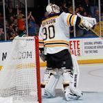 The Bruins’ Chad Johnson ignores the Islander party behind him after Thomas Vanek’s goal in the second.