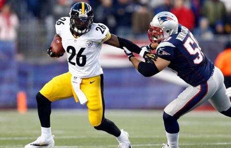 Rob Ninkovich put pressure on the Steelers’ Le’Veon Bell.
