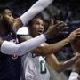 Celtics guard Avery Bradley went to the basket against Pistons center Andre Drummond in the first half.