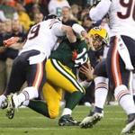 Aaron Rogers is taken down by Chicago’s Shea McClellin during Monday night’s game.(Photo by Mike McGinnis/Getty Images)