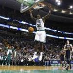 Celtics forward Brandon Bass slammed home two points late in the game to help seal the win.