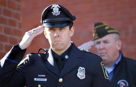 MBTA Police Officer Richard H. Donohue, Jr.  saluted during a Veterans Day ceremony in Winchester.
