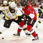 The Bruins’ Patrice Bergeron and the Senators’ Kyle Turris faced off in the second period.