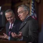 Democratic Senate Majority Leader Harry Reid (right) spoke after the Senate passed rules curbing filibusters.