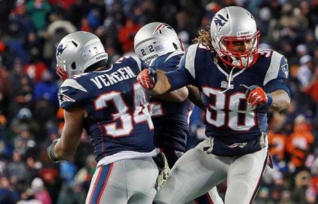 Brandon Bolden, right, celebrated with Shane Vereen and Stevan Ridley after his third-quarter touchdown. 
