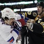 The Rangers’ Brian Boyle bravely tangles with Bruins captain Zdeno Chara in the second period. (AP Photo/Winslow Townson)